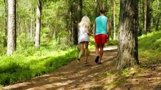 Couple looks hot from behind while walking in forest